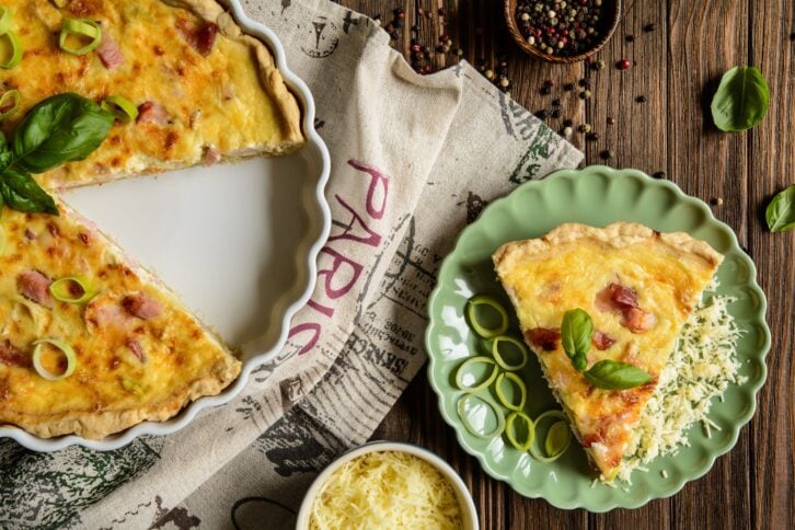 Traditional French Quiche Lorraine with Cheddar, Camembert, bacon and eggs