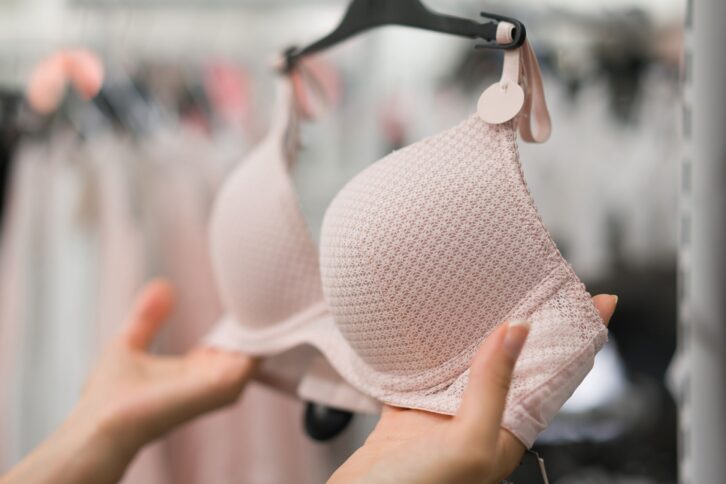 woman buying bra in underwear store