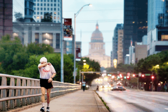 Senior man power walking early morning in Austin Texas