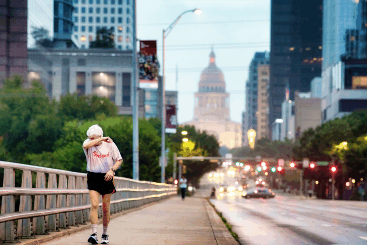 Senior man power walking early morning in Austin Texas