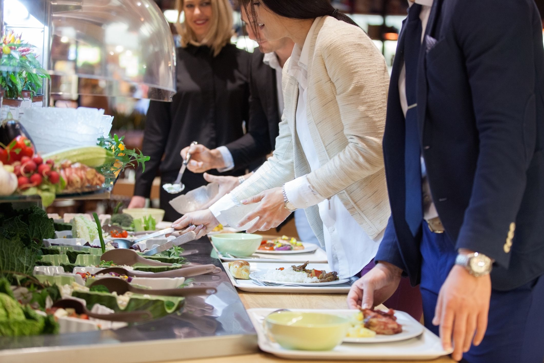 Business people picking from a salad bar