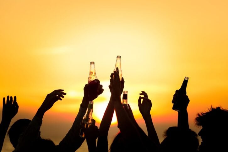 Friends Beach Party Drinks Toast Celebration Concept.