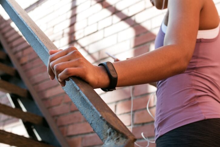 close up of female hand with activity tracker