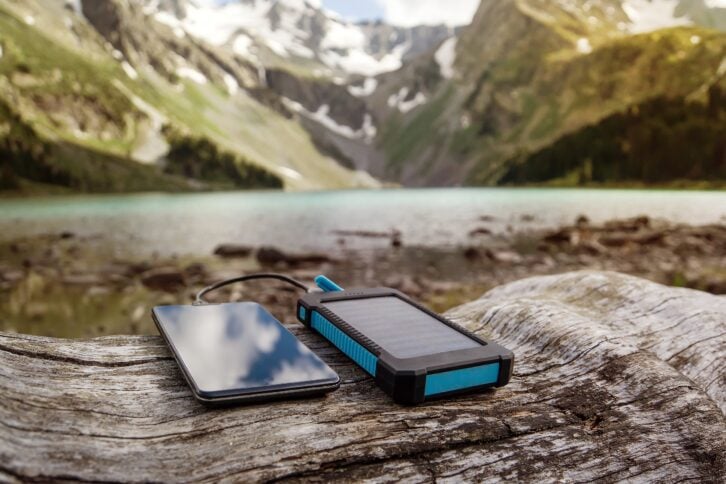 battery solar energy device on the background of beautiful mountain scenery