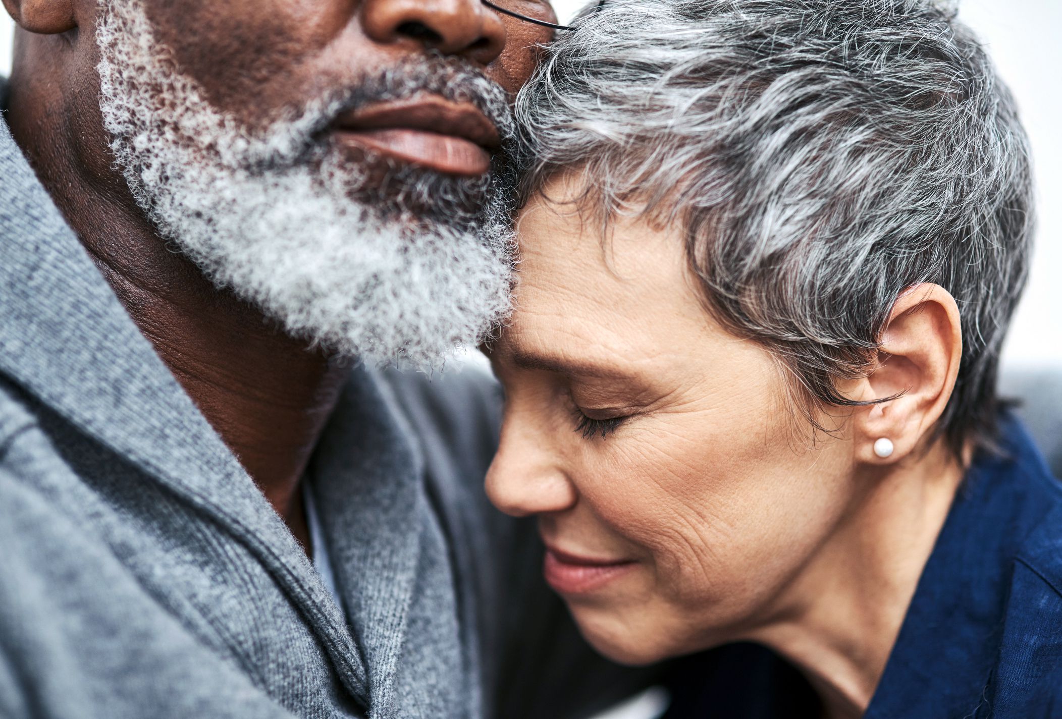 close-up of senior couple embracing