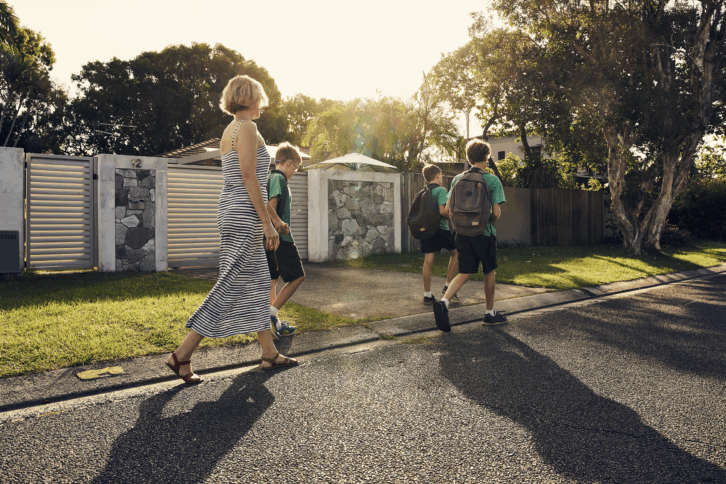 mom walking her kids to school