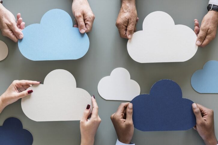 hands holding clouds, cloud network storage concept
