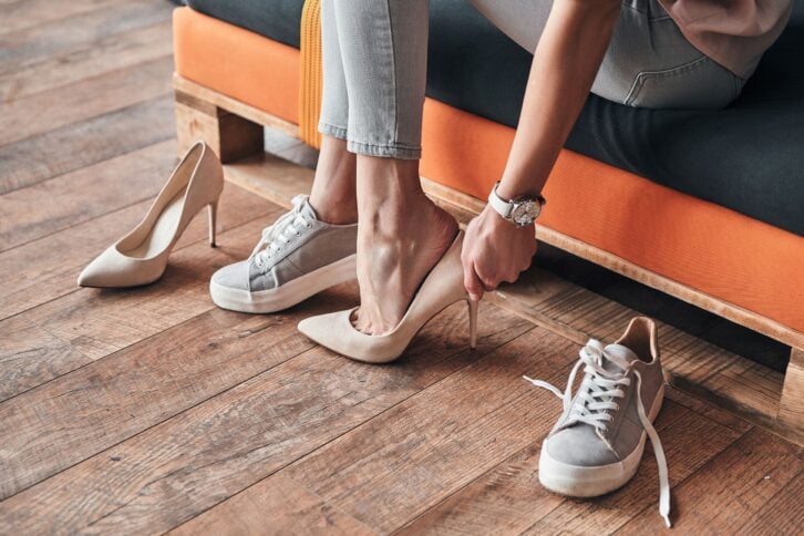 woman trying on pumps in store
