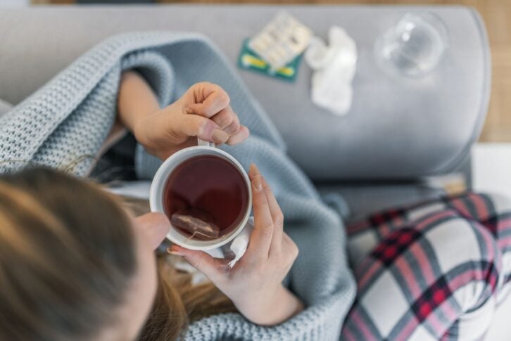 Woman suffering from cold flu