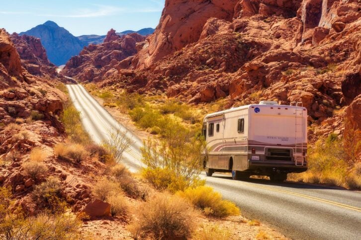 rv driving through desert