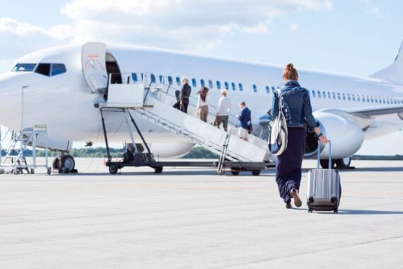 woman walking towards the airplane