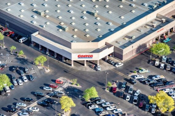 Mesa, United States - April 10, 2018:  The exterior and store sign of a Costco warehouse wholesale outlet located in Mesa, Arizona shot from an altitude of about 1000 feet.