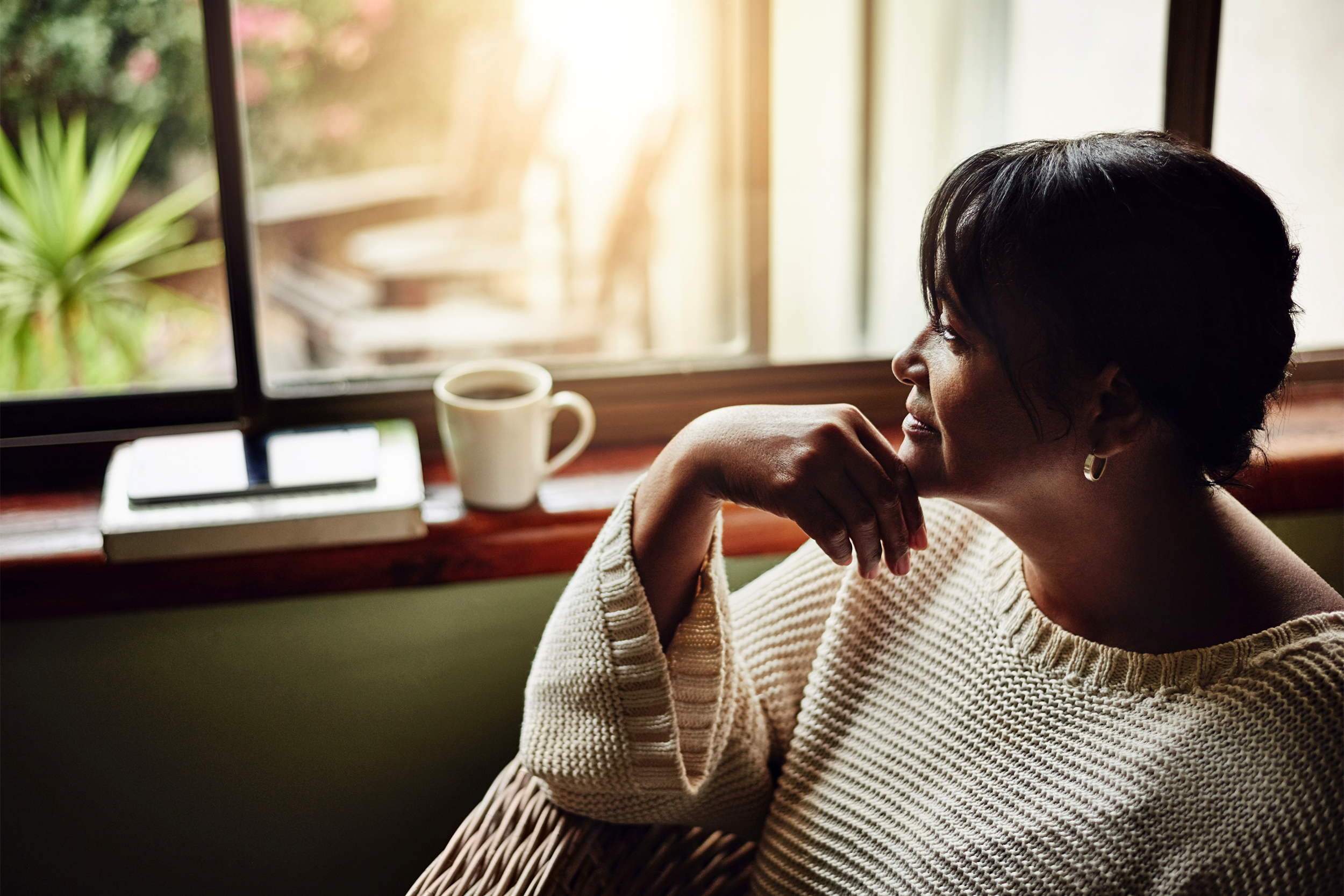 senior woman looking out window
