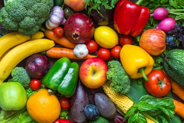 Assortment of fresh harvested fruits and vegetables on the table. top view