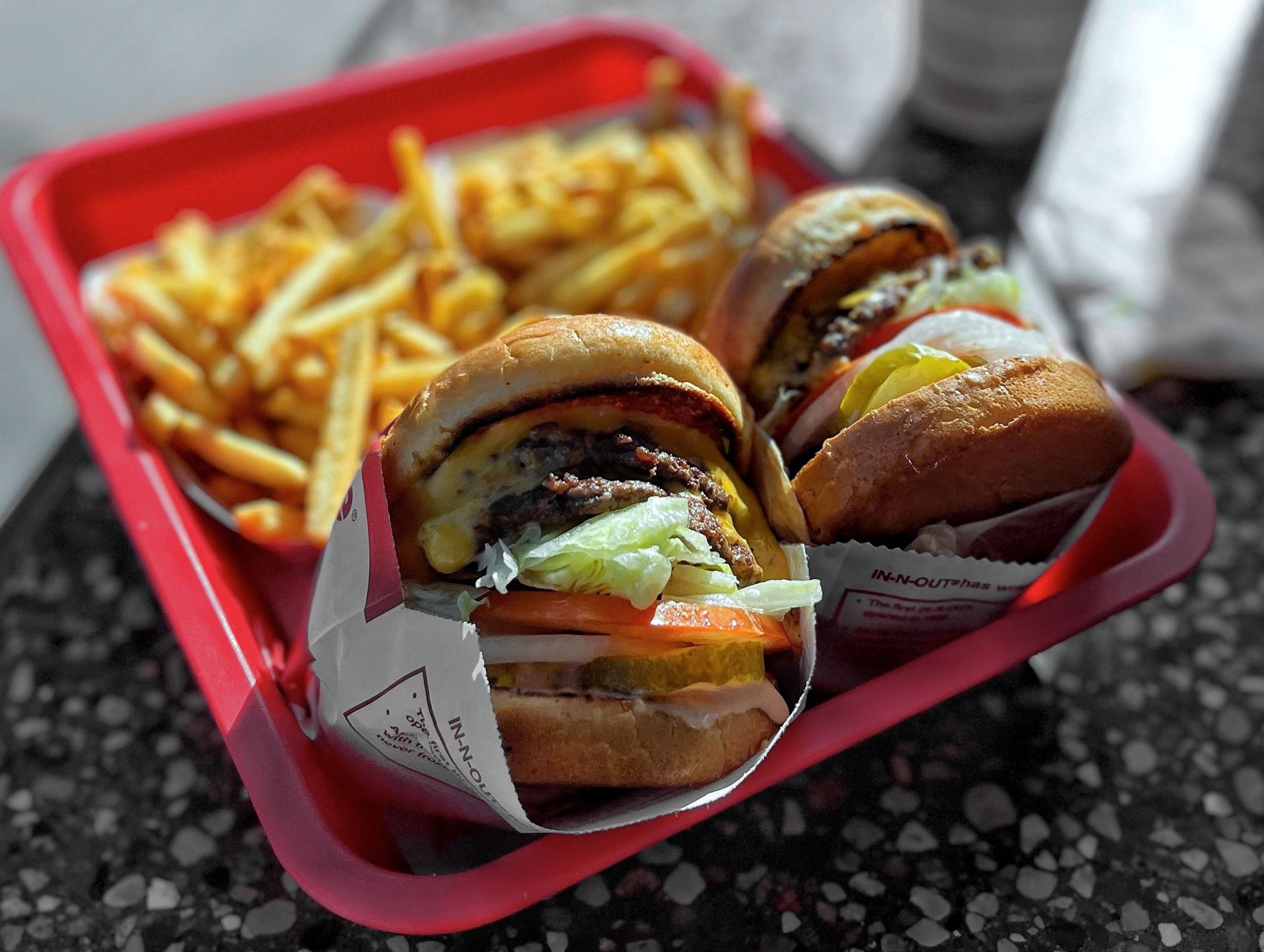 two burgers and fries from In-N-Out Burger