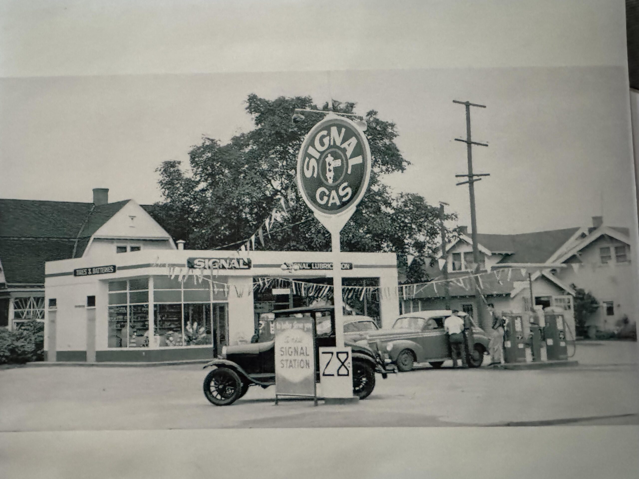 My grandfather’s service station Sept 1955. My 19yr old father at the pumps helping a customer - Portland OR