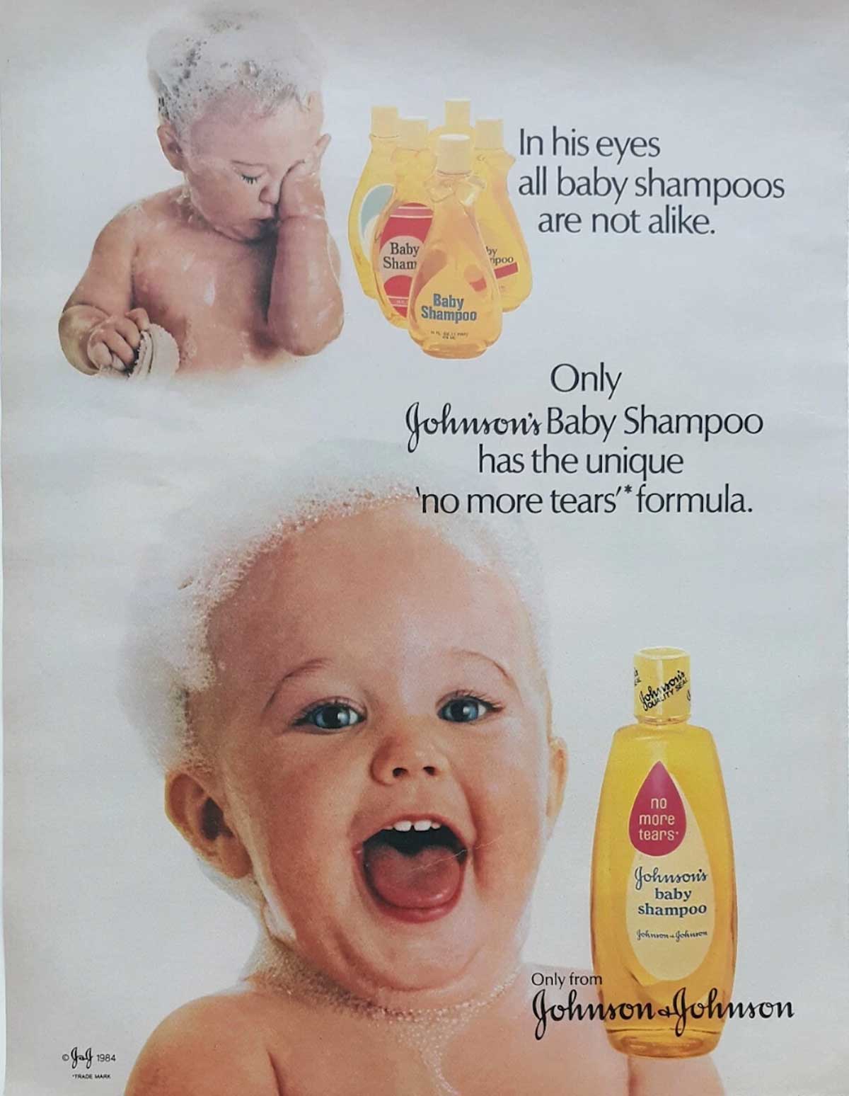 A vintage 1980s Johnson’s Baby Shampoo ad featuring a laughing baby covered in bubbles, shampoo bottles, and text highlighting the “no more tears” formula and the uniqueness of their gentle baby shampoo.