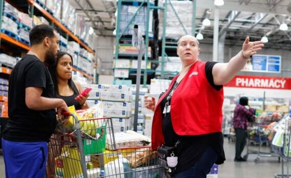 A staff speaks to customers inside a Costco store on June 28, 2023 in Teterboro, New Jersey.