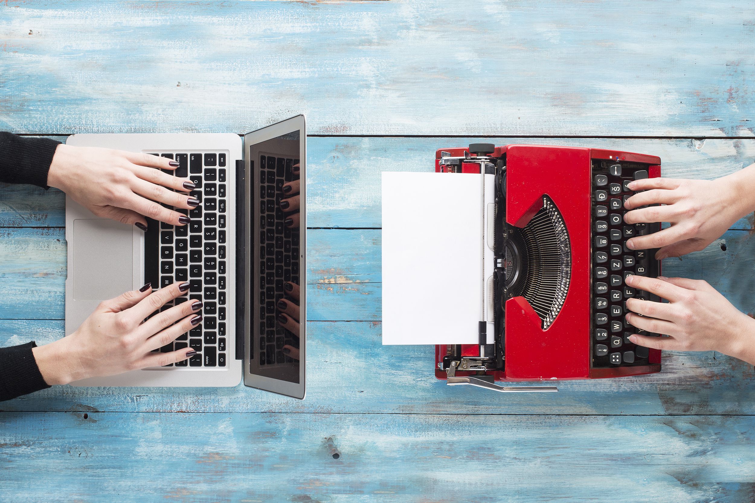 Macbook Air On Left And Red Typewriter On The R