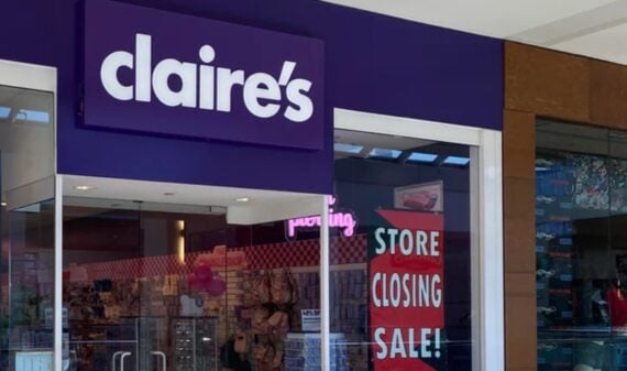 Storefront of Claire’s in a mall, with a large purple sign above the entrance and a red sign in the window that reads "Store Closing Sale!" The store interior is visible through glass doors.