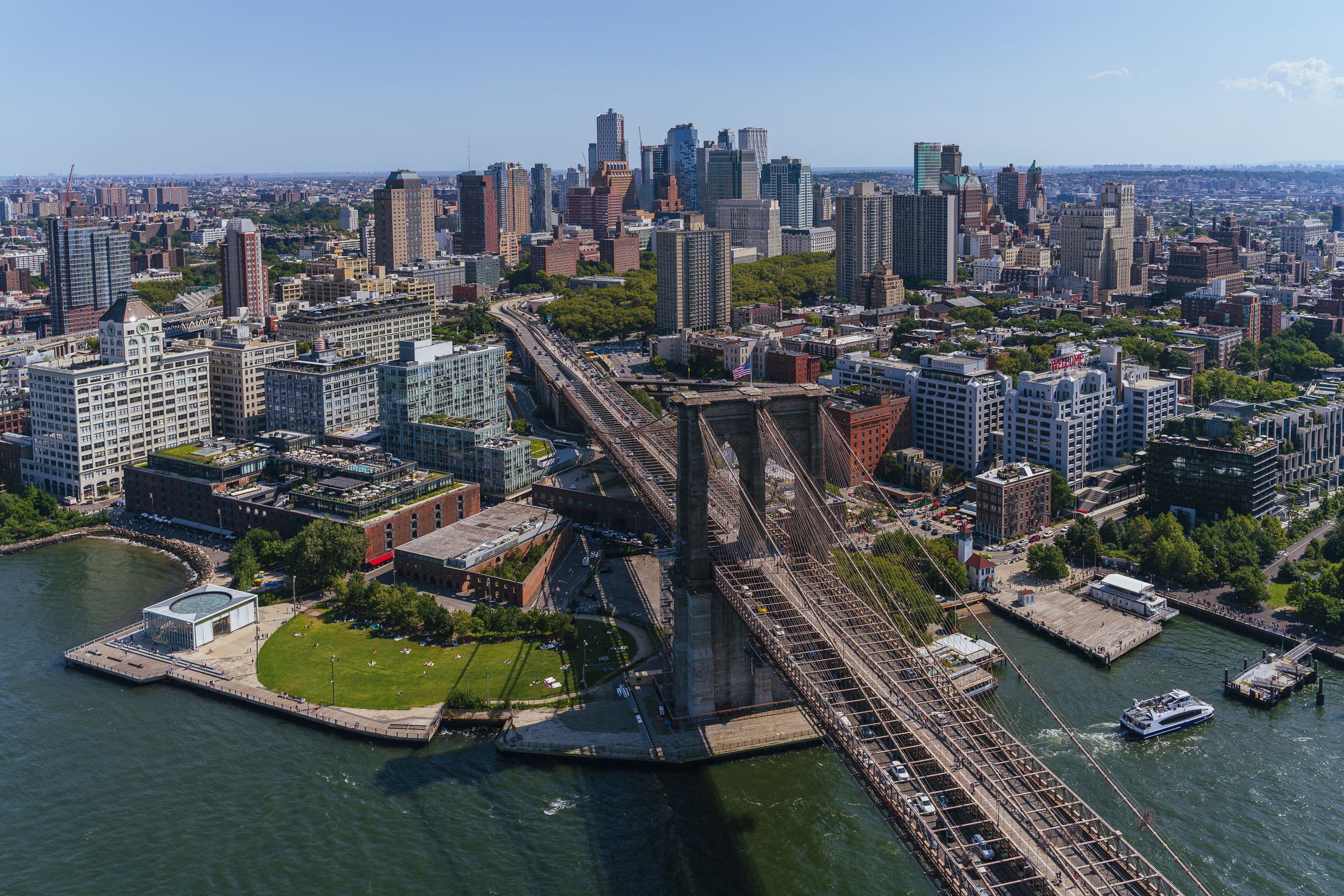 Aerial view of New York City from a helicopter on a sunny summer day.