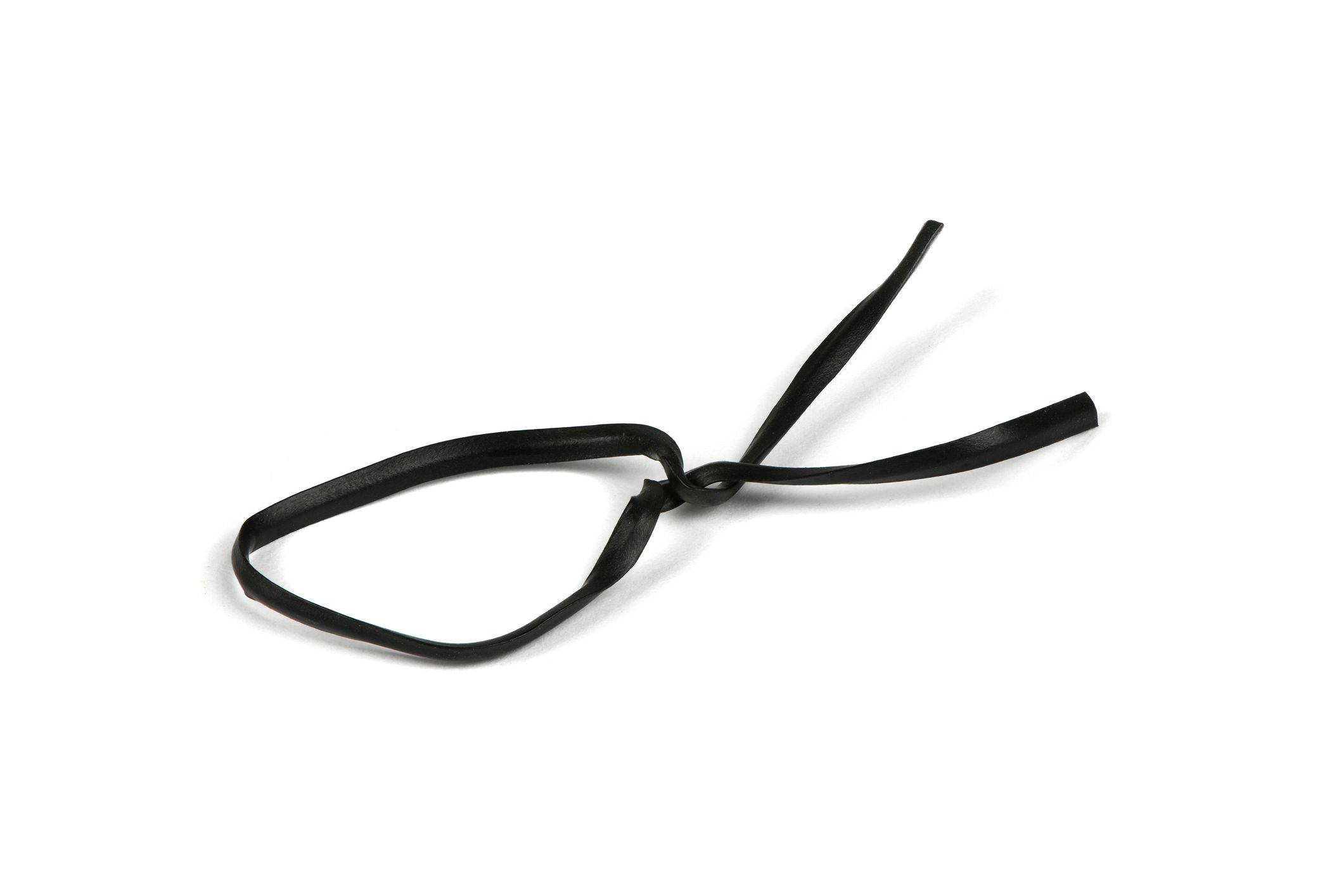 Black plastic coated wire tie used for a variety of things on white background. High resolution photo. Full depth of field