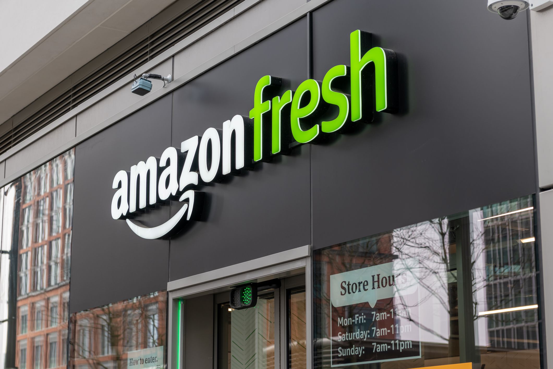 London. UK-03.30.2022. The name sign and frontage of the branch of Amazon Fresh grocery store in Canary Wharf.