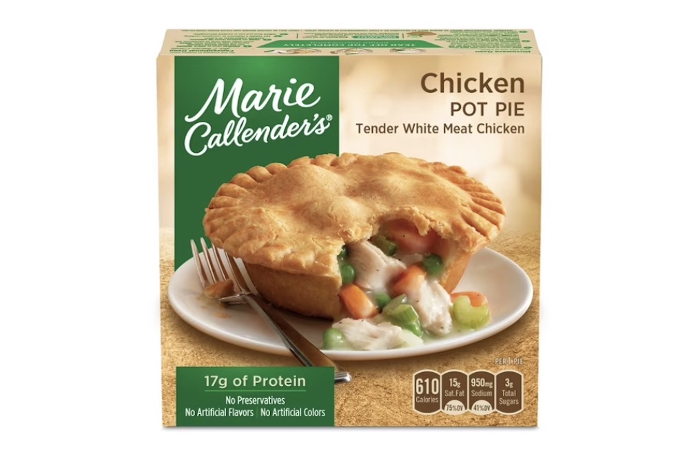 A Marie Callender's Chicken Pot Pie box featuring an image of a golden pot pie on a plate, filled with chicken, peas, carrots, and gravy. Nutritional info and product features are displayed on the packaging.