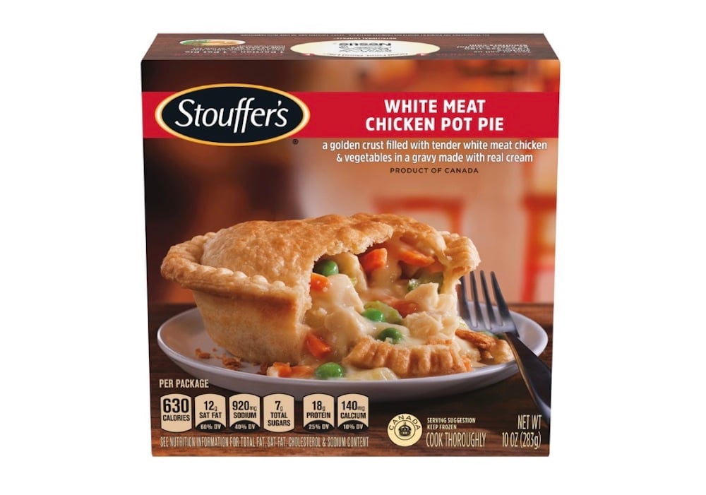 A box of Stouffer’s White Meat Chicken Pot Pie features an image of a baked pot pie filled with chicken and vegetables in creamy gravy, with nutritional info and serving suggestions on the front.