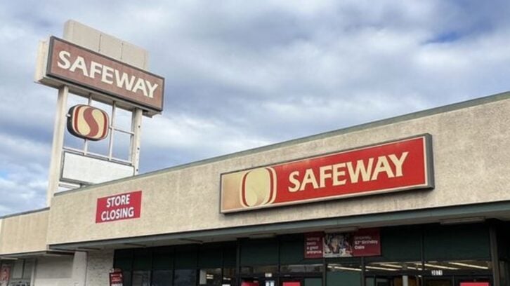 A Safeway grocery store with red signs, including one that reads "STORE CLOSING," under a cloudy sky. The storefront and a tall Safeway sign are visible.