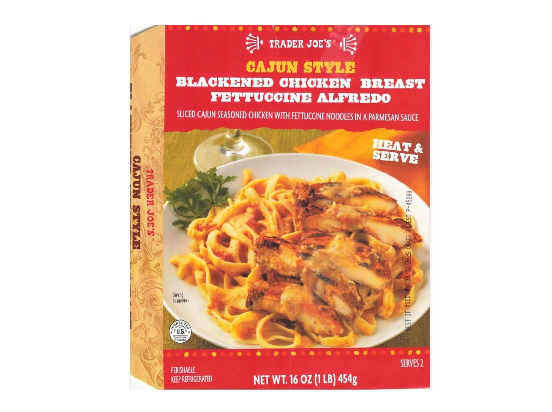 Box of Trader Joe’s Cajun Style Blackened Chicken Breast Fettuccine Alfredo, showing pasta with chicken pieces in creamy sauce on the front. Text highlights it as heat & serve, 16 oz, refrigerated.
