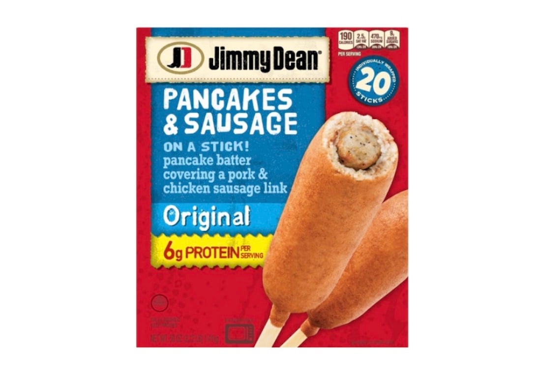 Jimmy Dean Pancakes & Sausage on a Stick, Original flavor, 20 sticks box. Image shows two pancake-wrapped sausage sticks with product details on a red background, highlighting 6g protein per serving.