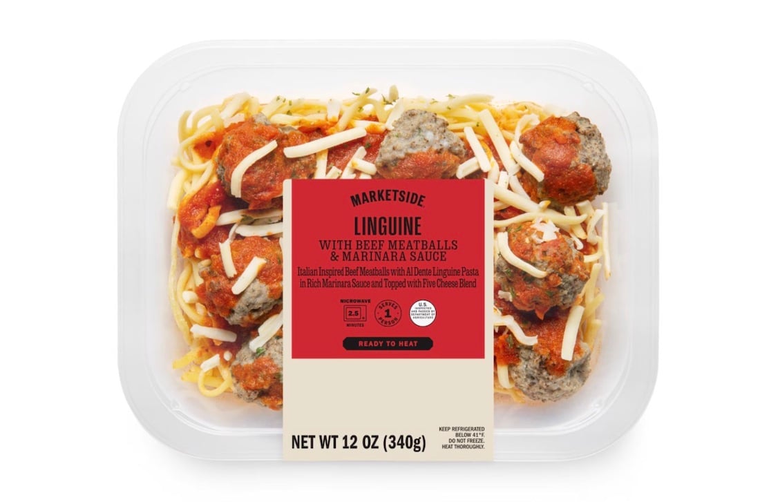 A clear plastic container of Marketside Linguine with Beef Meatballs & Marinara Sauce. The meal includes meatballs, marinara sauce, linguine pasta, and shredded cheese, with a red and beige label on top. Net weight 12 oz (340g).
