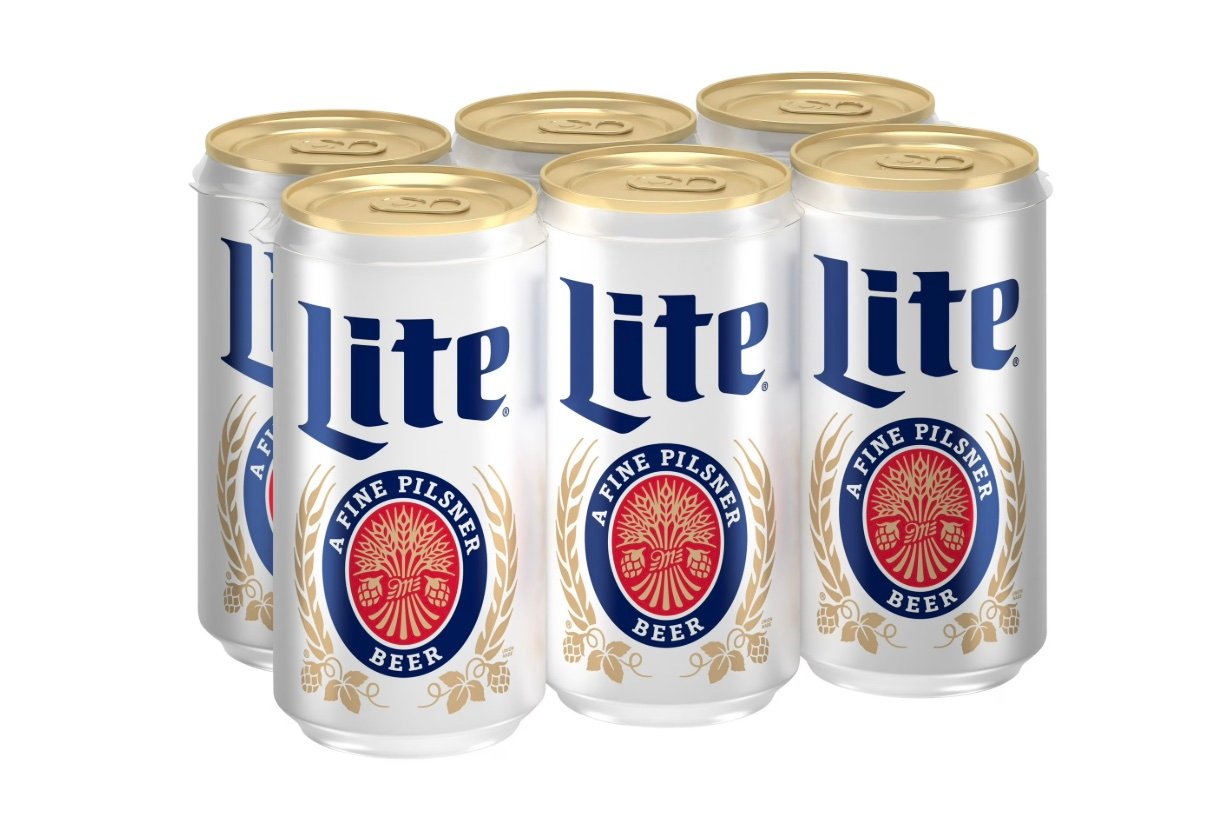 Six cans of Miller Lite beer are grouped together. The cans are white with gold tops, blue "Lite" text, and a red and gold emblem that reads "A Fine Pilsner Beer" on the front.