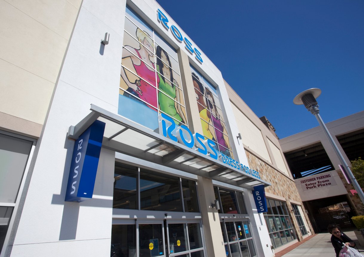 The exterior of a Ross Dress for Less store with large colorful window art, blue sky above, part of a parking structure in the background, perfect for those searching for a "ross near me" or exploring dds discounts nearby.
