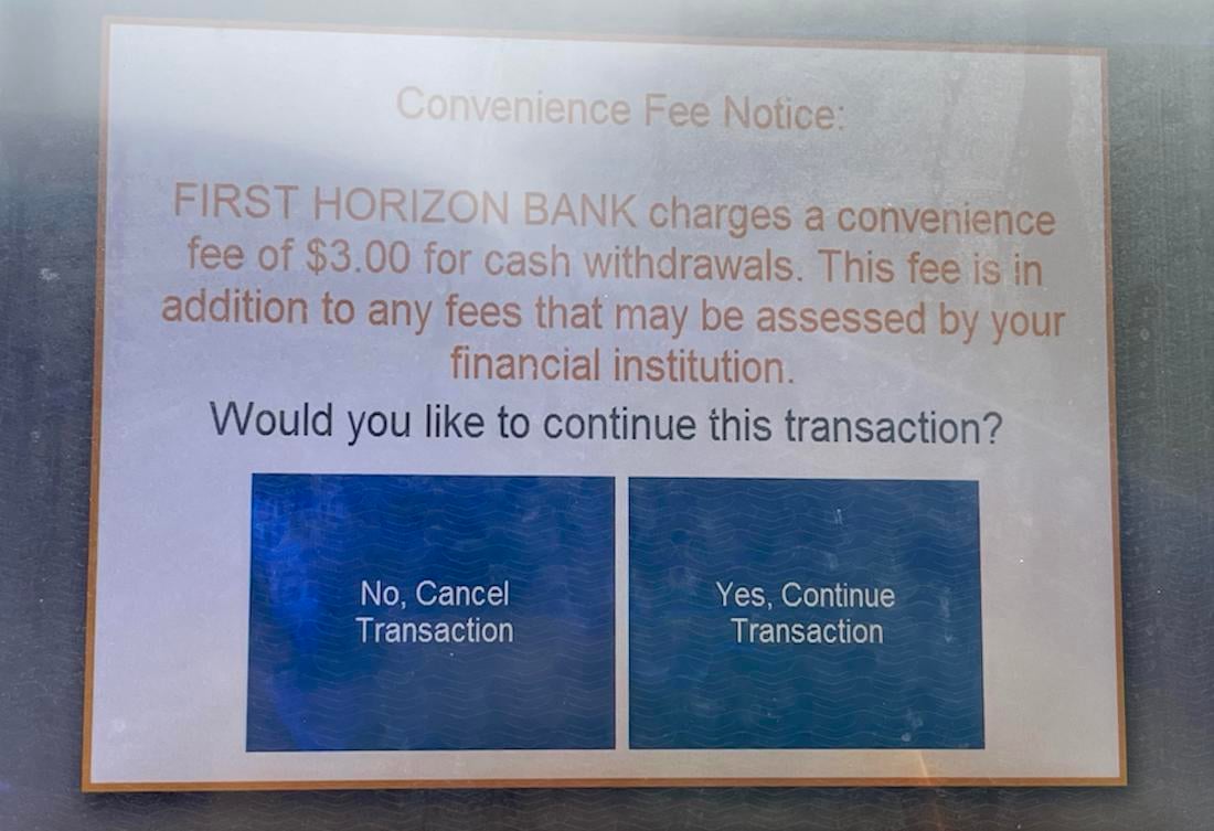 ATM screen displays a notice: "First Horizon Bank charges a $3 convenience fee for cash withdrawals, in addition to other bank fees." Below are options: "No, Cancel Transaction" and "Yes, Continue Transaction.