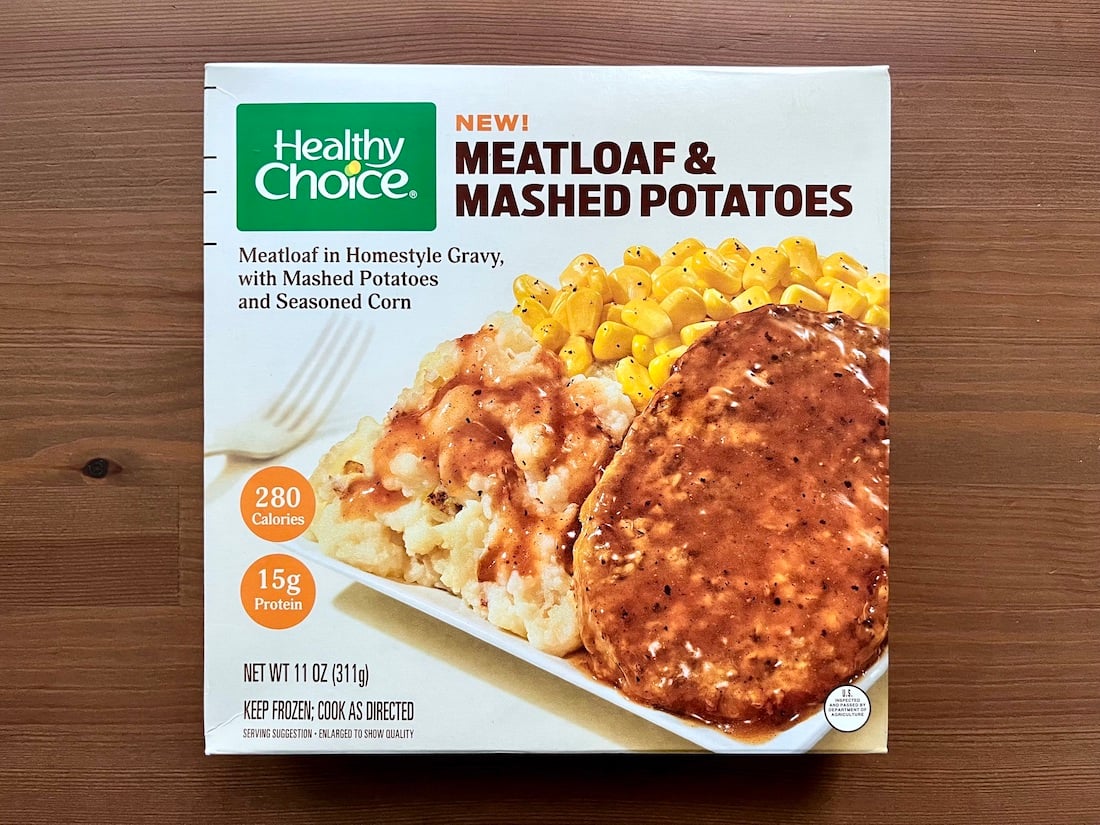 A Healthy Choice frozen meal box featuring meatloaf with gravy, mashed potatoes, and seasoned corn. The packaging highlights 280 calories and 15g protein per serving, and shows an image of the meal on a white plate.