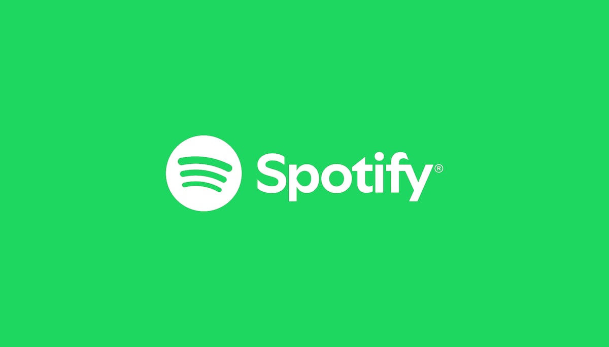 The Spotify logo, featuring a white circle with three curved lines inside, next to the word "Spotify" in white text, is displayed on a bright green background.