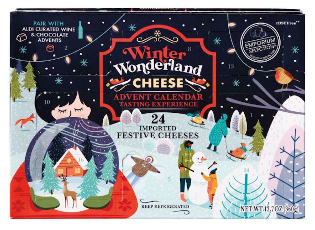 A colorful box labeled "Winter Wonderland Cheese Advent Calendar Tasting Experience" features festive, snow-covered trees, people ice skating, and holiday decorations. The box contains 24 imported festive cheeses.
