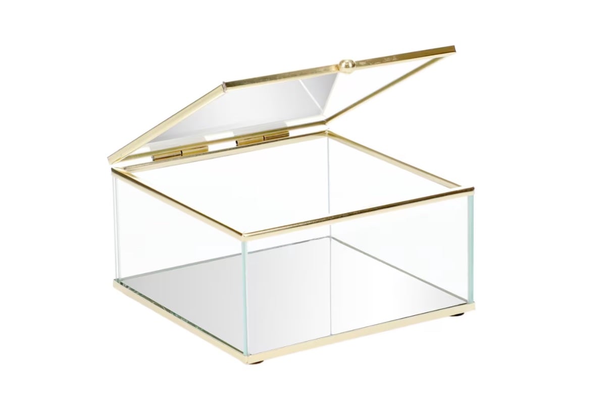 A square glass box with gold metal edges and an open, hinged glass lid, shown on a white background.