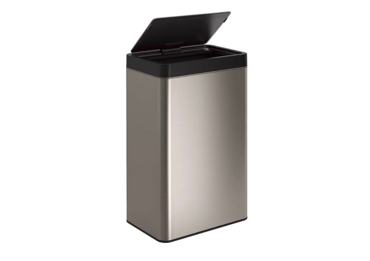 A modern, rectangular stainless steel trash can with a black lid that is partially open, set against a plain white background.