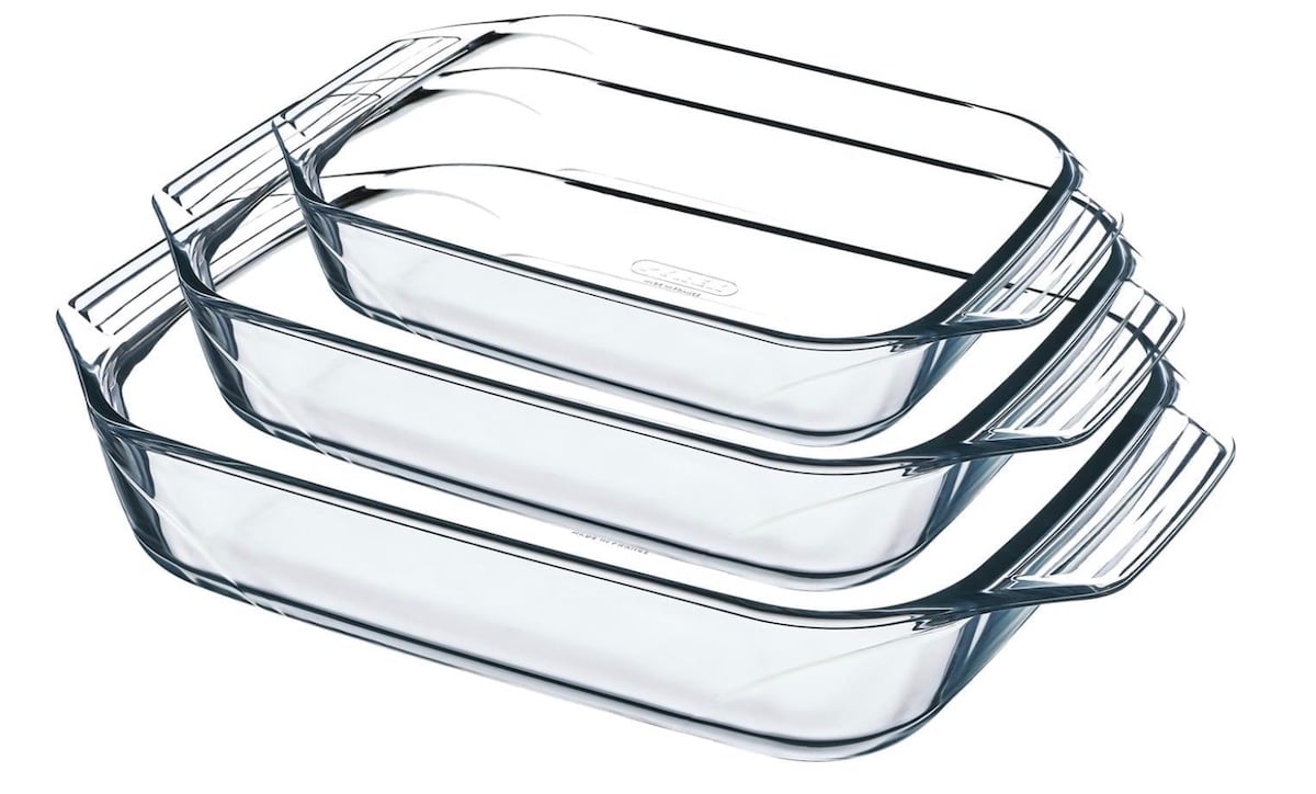 Three clear glass rectangular baking dishes of different sizes are stacked inside each other, each with handles on both sides, against a white background.