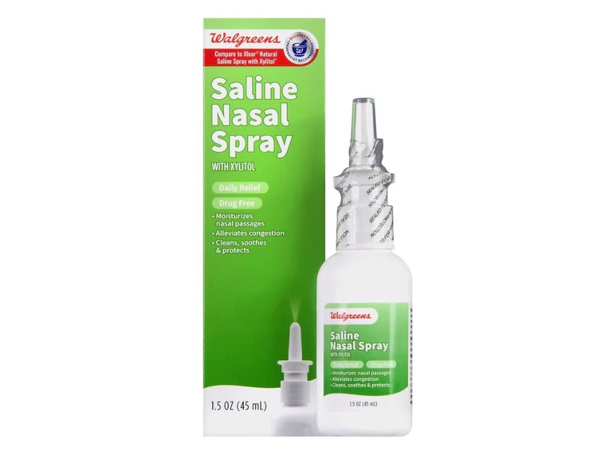 Box and bottle of Walgreens Saline Nasal Spray with Xylitol, labeled for daily relief, drug free, moisturizing nasal passages, and relieving congestion. The bottle is 1.5 oz (45 mL).