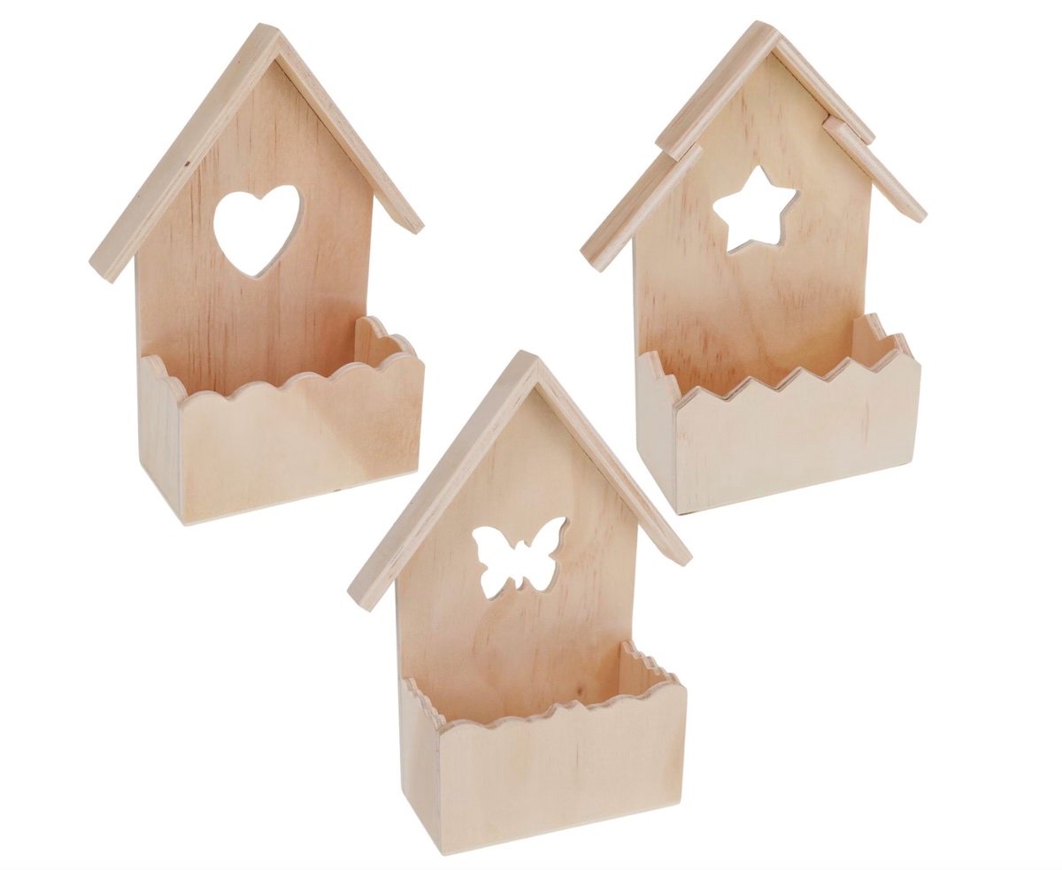 Three small wooden wall shelves shaped like houses, each with a different cutout design (heart, star, and butterfly) on the back panel. The wood appears unfinished and the shelves have scalloped edges.