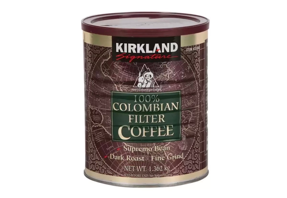 A can of Kirkland Signature 100% Colombian Filter Coffee, Supremo Bean, dark roast, fine grind, net weight 1.36 kg, with a maroon lid and decorative brown label.
