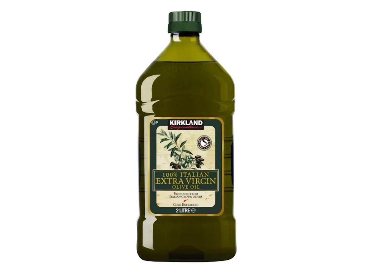 A 2-liter bottle of Kirkland 100% Italian Extra Virgin Olive Oil with a green cap and a cream-colored label featuring olive branches and text.