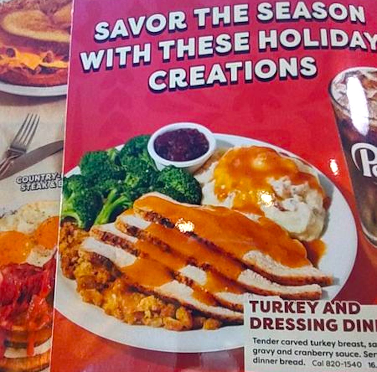 A plate of food featuring breaded chicken with orange sauce, mashed potatoes with gravy, steamed broccoli, and corn is shown in front of a red and white holiday-themed menu background.