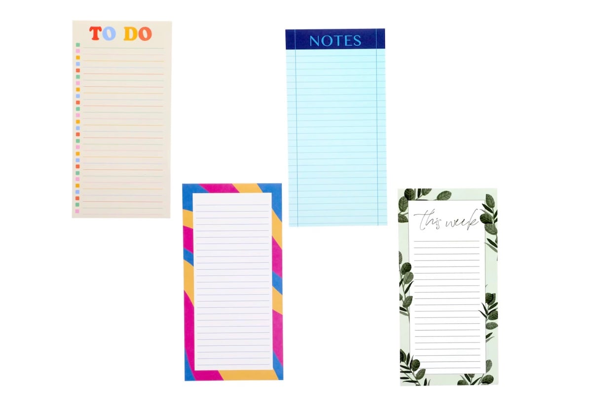 Four colorful notepads: a "TO DO" pad with rainbow accents, a blue "NOTES" pad, a striped pad with pink, blue, and yellow borders, and a leafy "this week" planner, all with lined spaces for writing.