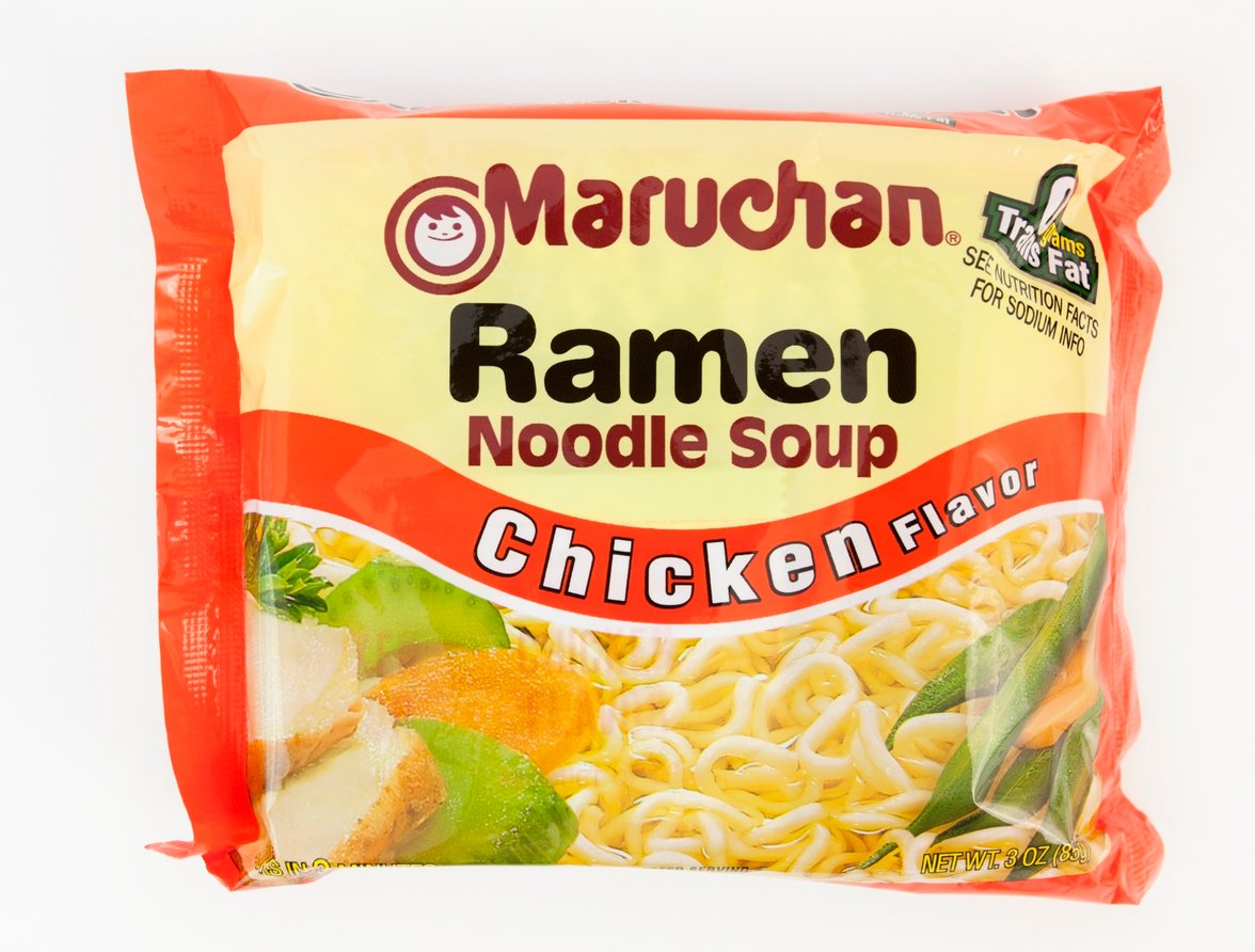 A package of Maruchan Ramen Noodle Soup in chicken flavor, featuring images of noodles and vegetables on the front with a yellow and red design. The package also notes "0g Trans Fat.