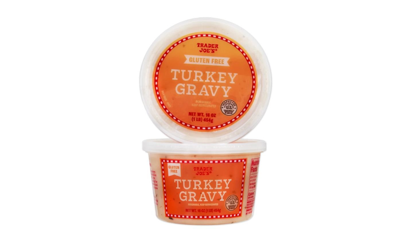 Two round plastic containers of Trader Joe’s Turkey Gravy, with orange and white labels stating "Gluten Free." One container is upright, the other is positioned to show the top label.